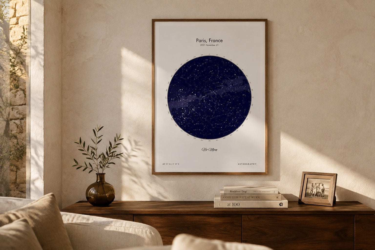 A Modern Sky map in an oak frame above a walnut sideboard.