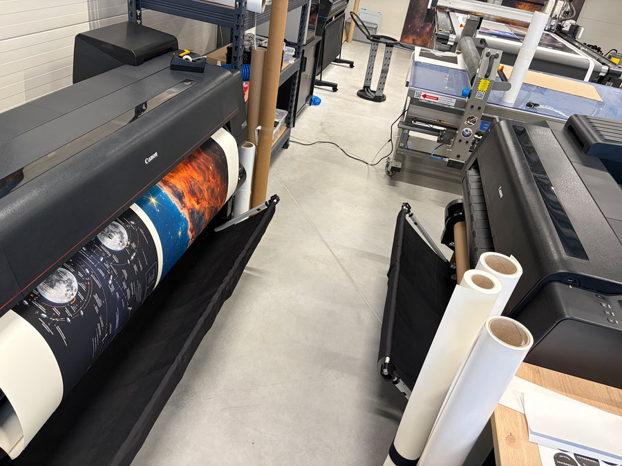 Large-format printers producing astronomy prints in the Astrography studio.